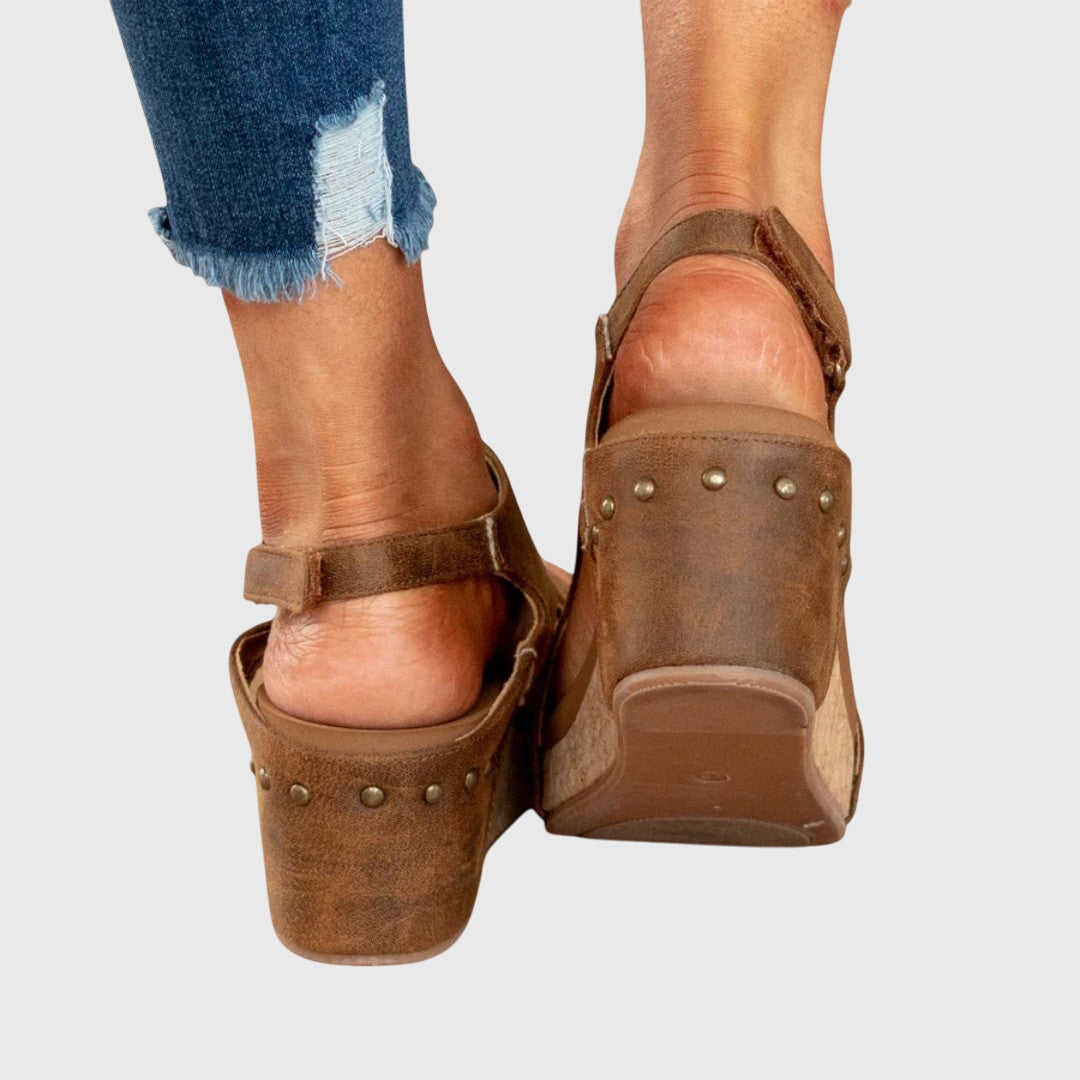 Brown orthopedic wedge sandals rear view with back strap and stud detail