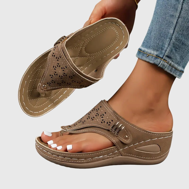 Brown orthopedic slide sandals with perforated upper and hook-and-loop strap