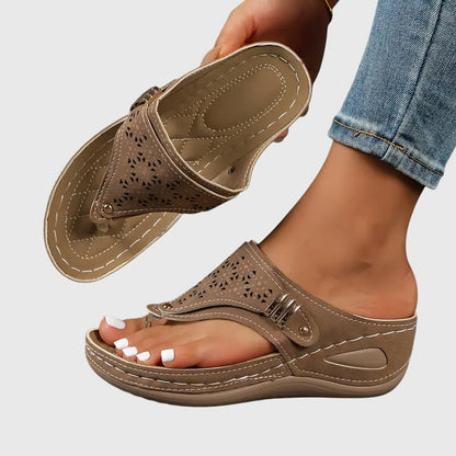 Brown orthopedic slide sandals with perforated upper and hook-and-loop strap