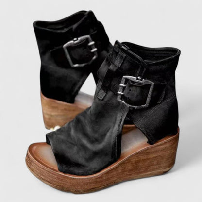 Black orthopedic wedge sandal with two adjustable buckle straps and open-toe cutout