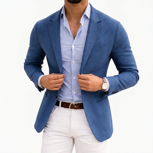 Blue knit blazer with notch lapels and front pockets, worn over a striped shirt.