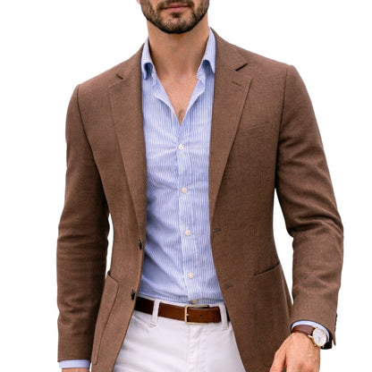 Brown knit blazer with notch lapels and front pockets, worn over a striped shirt.
