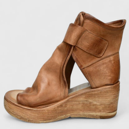 Tan brown orthopedic wedge sandal with adjustable buckle strap and open-toe opening