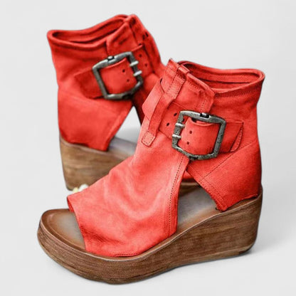 Red orthopedic wedge sandals with two adjustable buckle straps and open-toe design