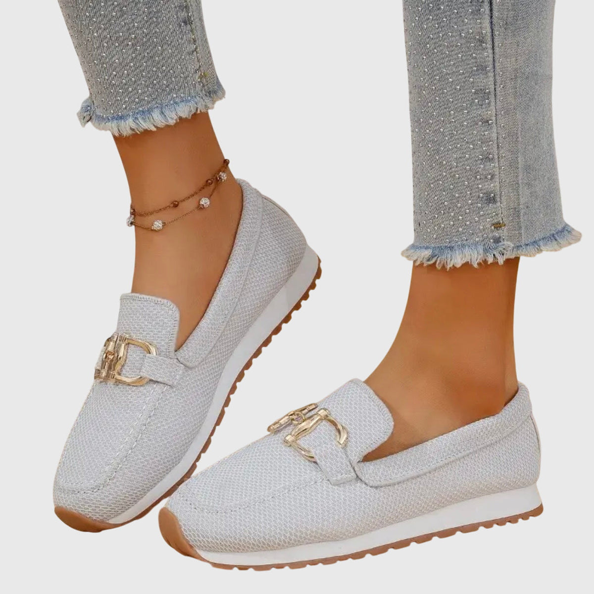White orthopedic mesh loafers with gold buckle bit and brown-trim sole