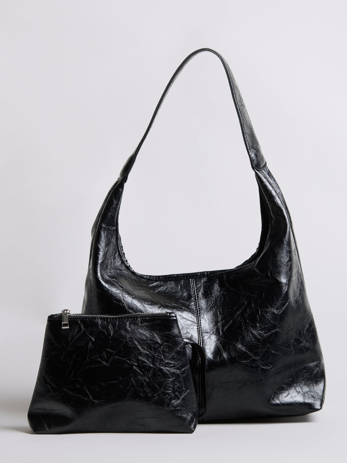 Black distressed vegan leather tote bag with small zip pouch accessory