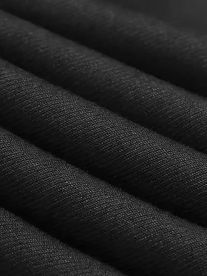Close-up of black suit fabric texture with fine woven pattern