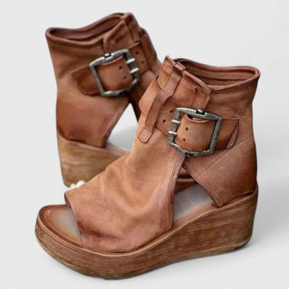 Brown orthopedic wedge sandals with two adjustable buckle straps and open-toe design