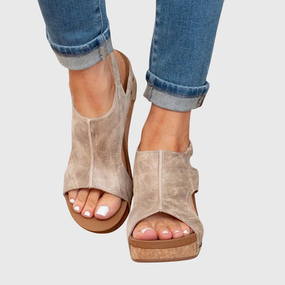 Beige orthopedic sandals with open toe straps and cushioned wedge sole