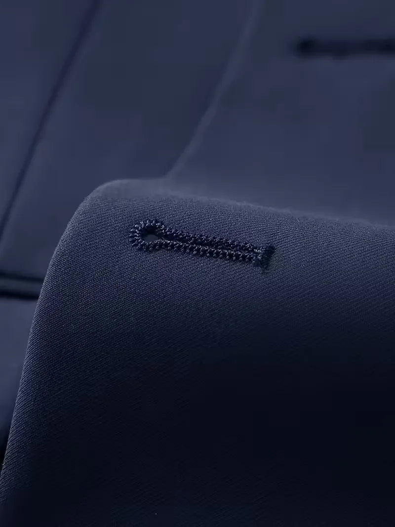 Navy suit lapel detail with stitched buttonhole