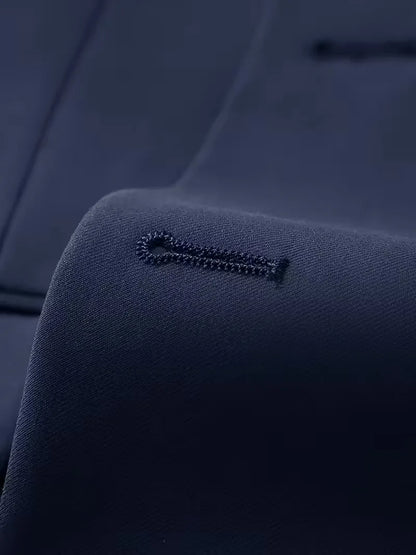 Navy suit lapel detail with stitched buttonhole