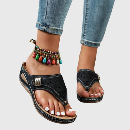 Navy orthopedic slide sandals with perforated toe and adjustable hook strap