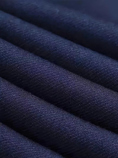 Navy suit fabric close-up with subtle woven texture