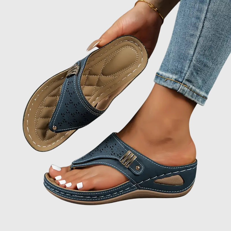 Navy orthopedic slide sandals with perforated upper and hook-and-loop strap