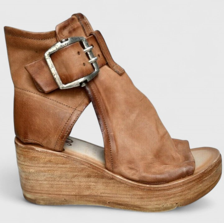 Brown orthopedic wedge sandal with silver-toned buckle strap and open toe