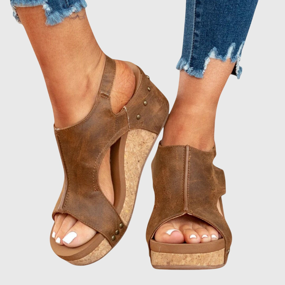 Brown orthopedic sandals with side stud grommets, open toe and wedge heel sole
