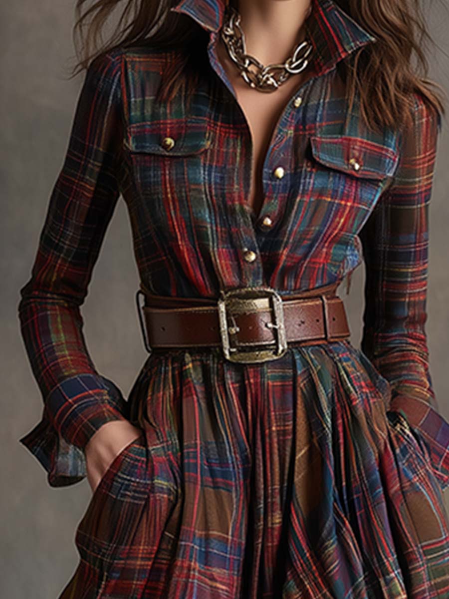 Close-up of reddish brown plaid shirt dress: button placket, chest pockets, and belt