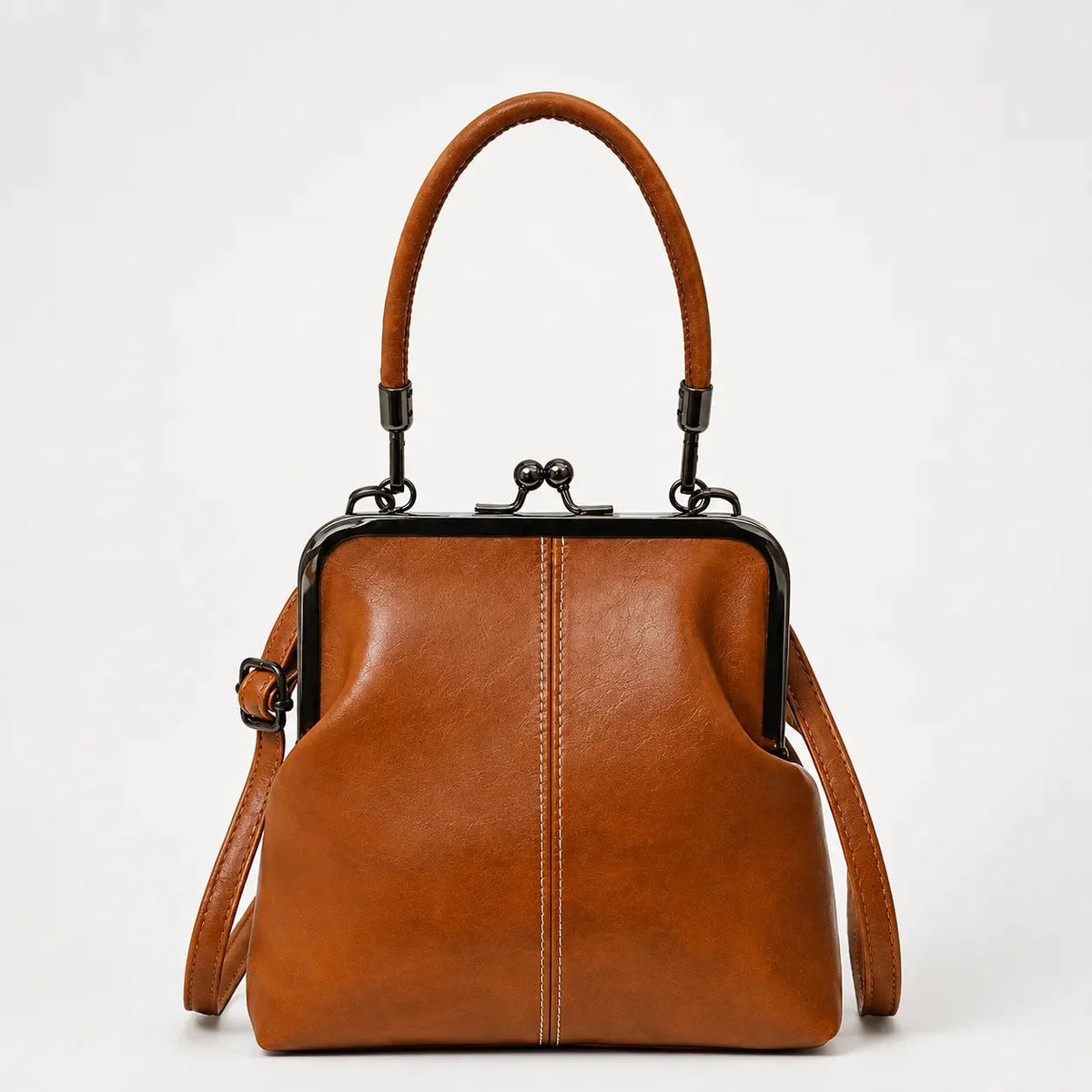 Cognac brown kiss-lock crossbody bag with top handle and leather shoulder strap