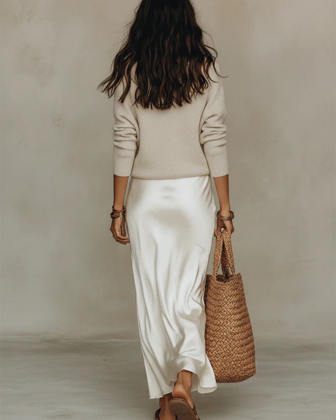 Back view cream satin midi slip dress with included off-white knit sweater
