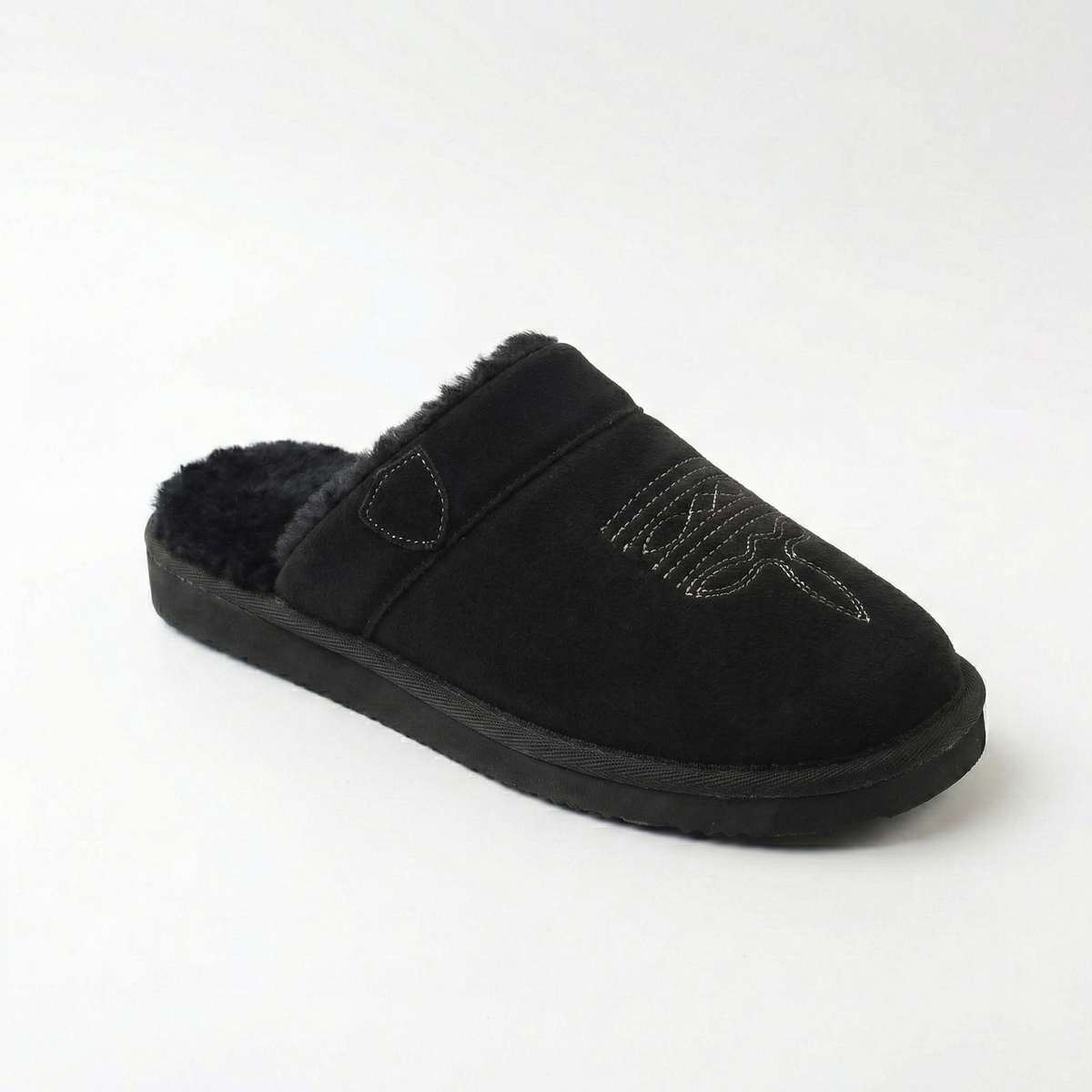 Cowboy slippers in black suede with faux-fur lining, stitched cowboy motif, and thick sole.