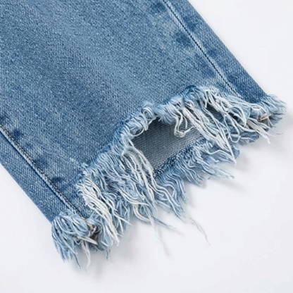 Frayed cropped hem on women's light blue denim jeans