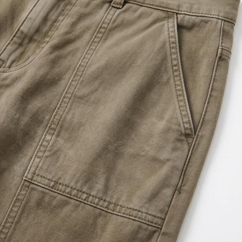 Warm khaki tailored utility pants with front pocket and curved seam detail