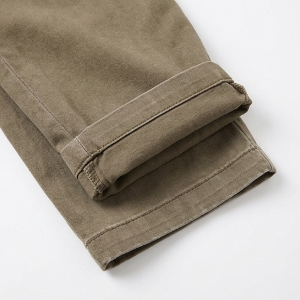Warm khaki cuffed trouser hem with stitched fold detail