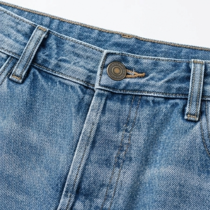 Button and fly detail on women's cropped light blue denim jeans with contrast stitching