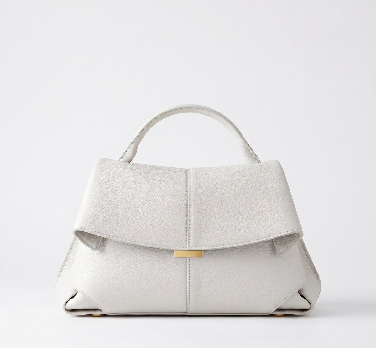 Off-white vegan leather handbag, short handles, front flap closure