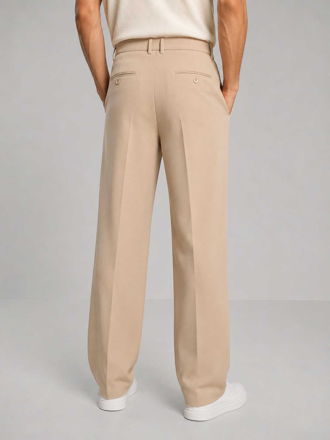 Light beige tailored straight-leg trousers with belt loops and front crease.