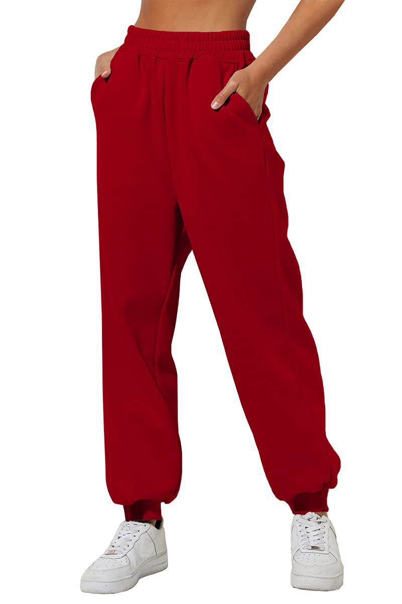 Red sweatpants joggers with elastic waistband and cuffed ankle hem.