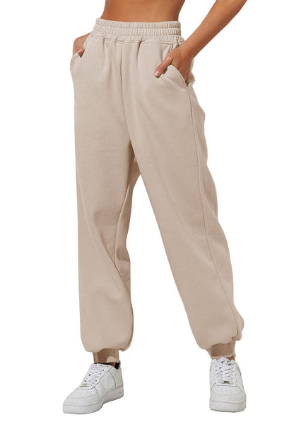 Beige sweatpants joggers with elastic waistband and cuffed ankle hem.