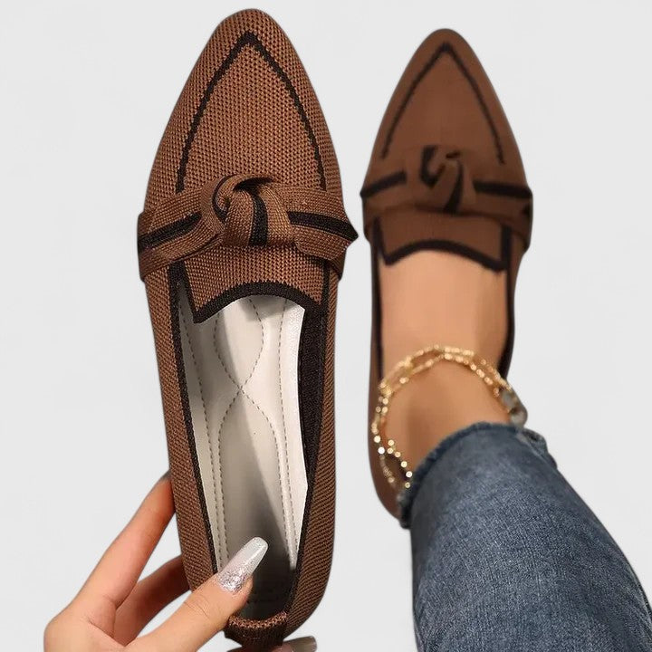 Brown orthopedic loafers with dark trim, lace bow and textured knit upper.