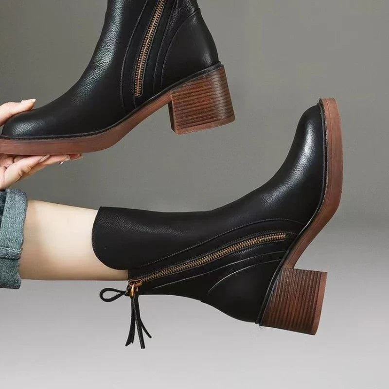 Black leather ankle boots with side zipper and tassel tie, block heel profile