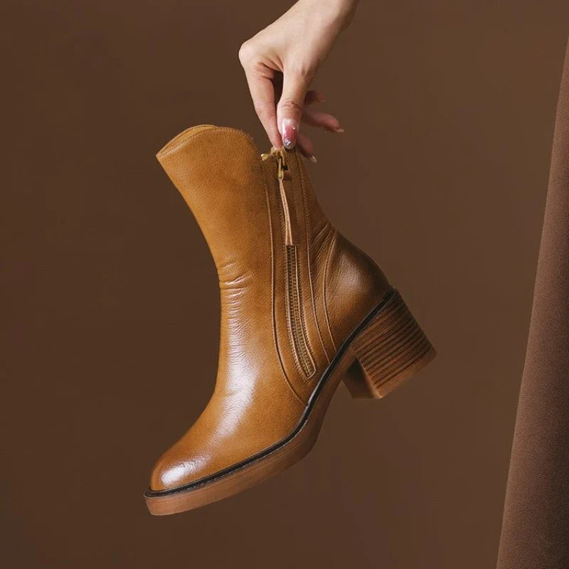 Brown ankle boots with side zipper, tassel pull, and chunky block heel