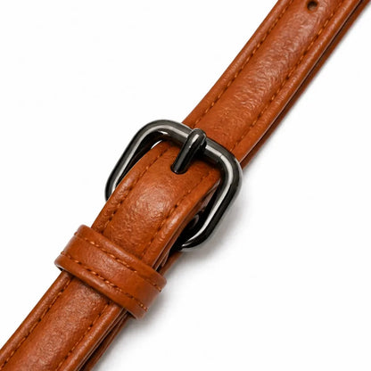 Cognac brown crossbody strap with metal D-ring buckle and stitched leather