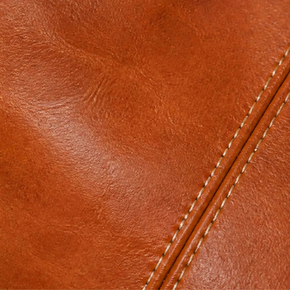 Cognac brown leather crossbody bag panel with stitched edge detail