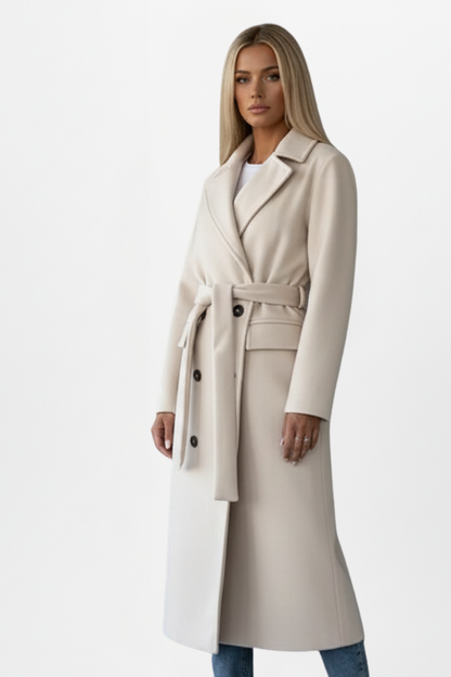 Women’s long light beige coat with belt tie and double-breasted button front