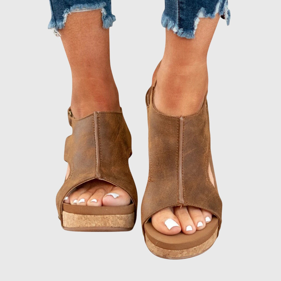 Brown orthopedic sandals with open toe straps and cushioned wedge sole