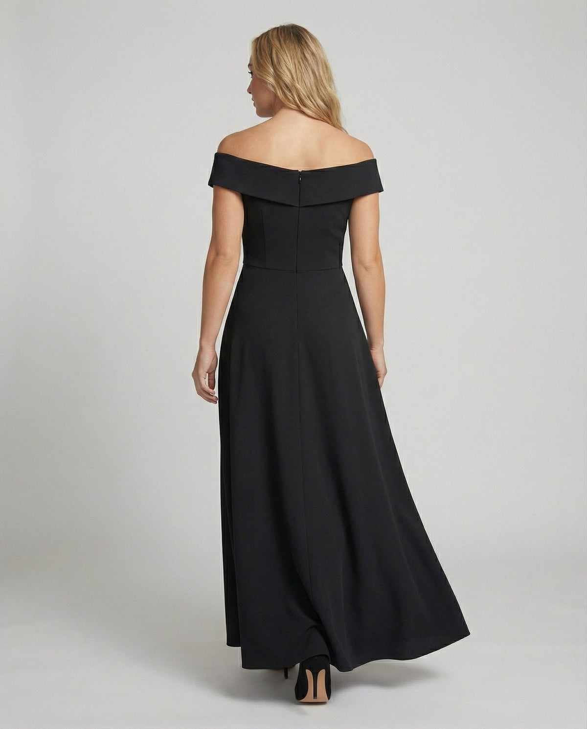 Back view of black off-shoulder long evening dress with wide neckline and flared hem