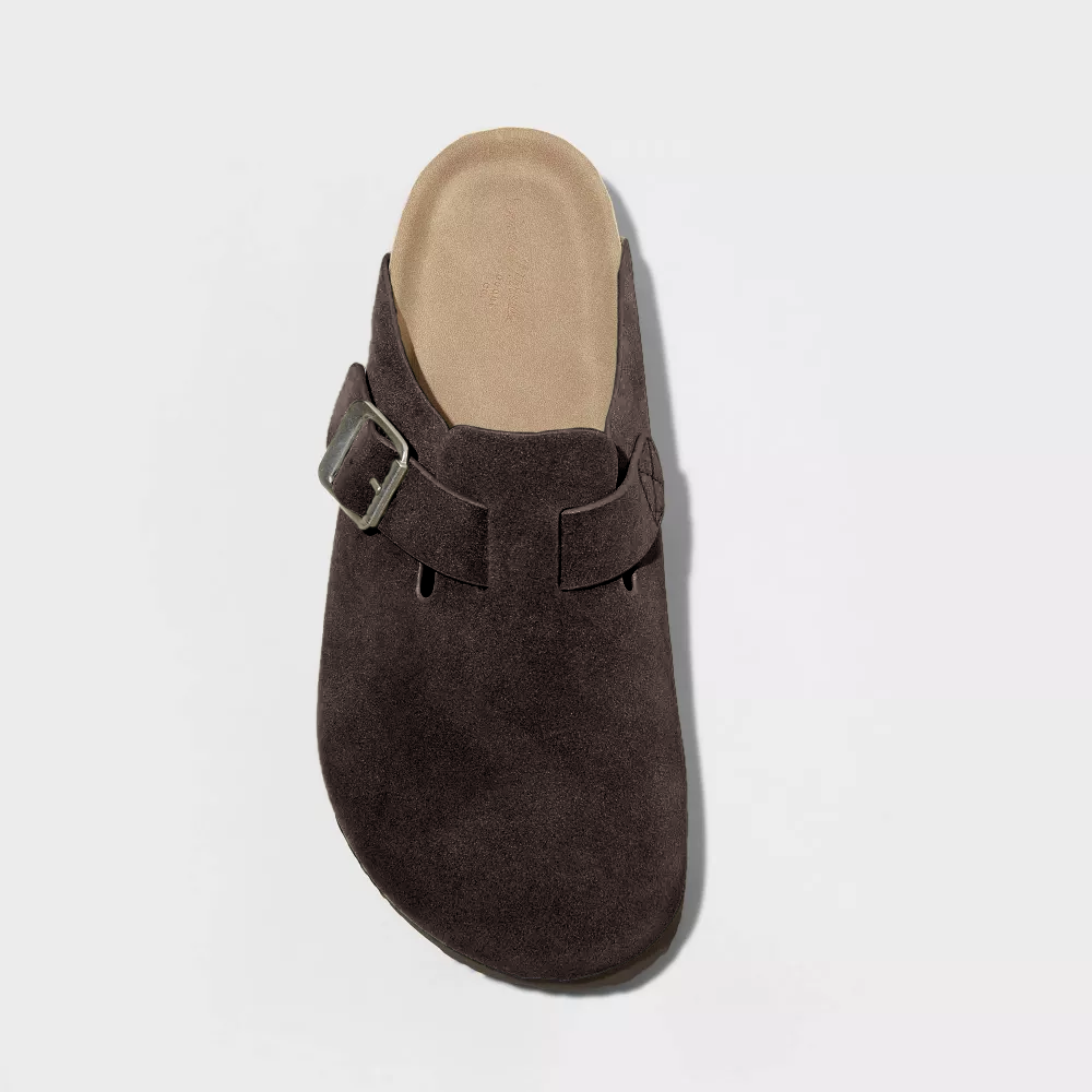 Dark brown suede clog front view with adjustable buckle strap and tan insole
