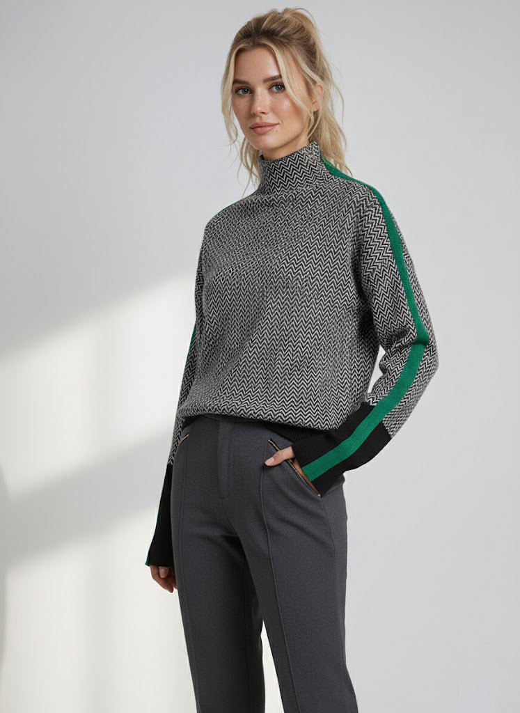 Grey chevron turtleneck sweater with contrasting green sleeve stripes and high neck