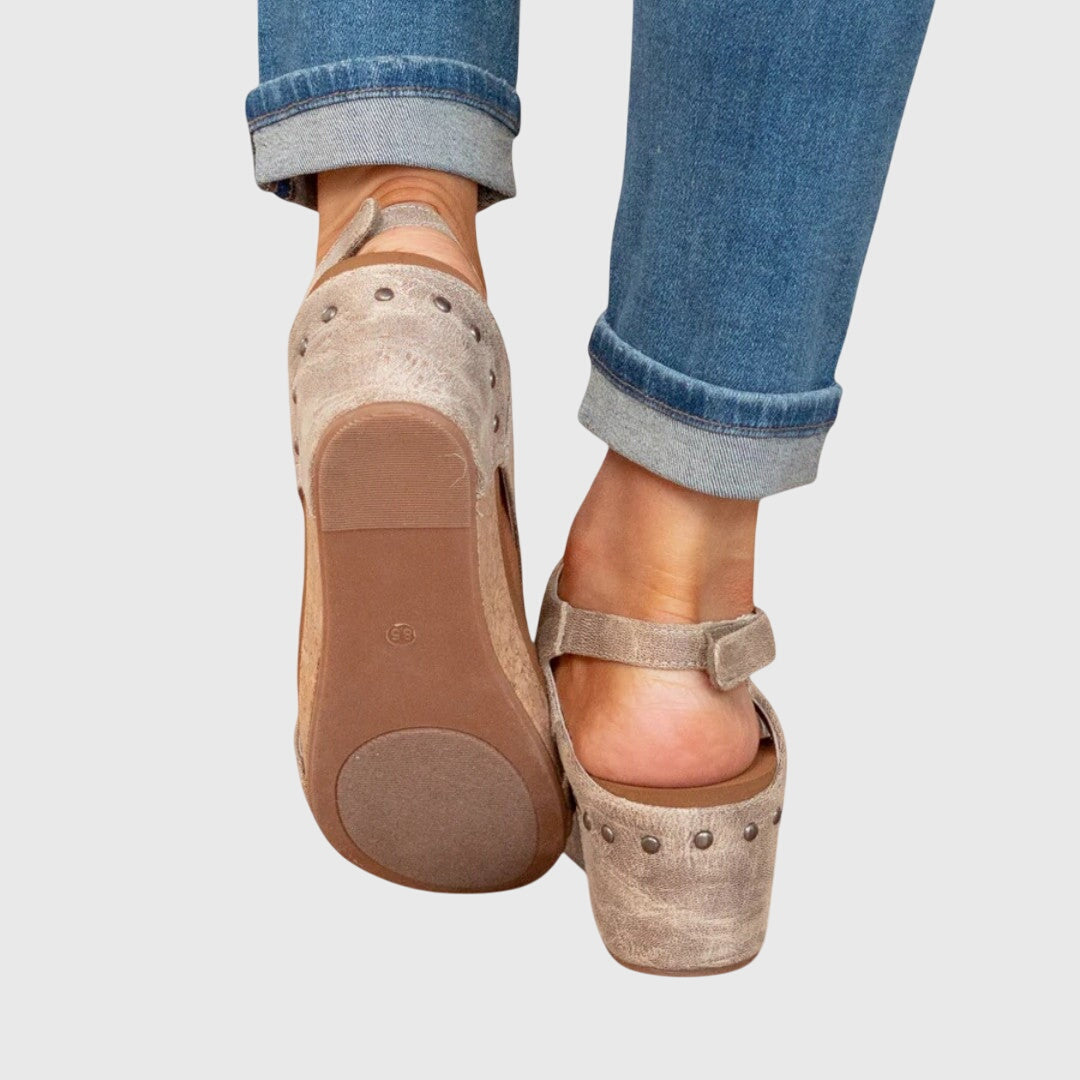 Beige orthopedic sandals, textured footbed with back strap and wedge heel underside