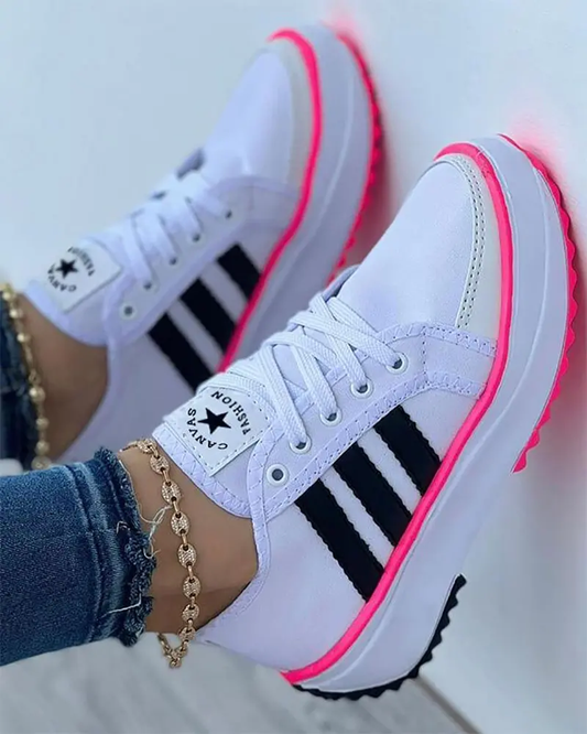 White comfort trainers with pink trim and black three-bar stripes