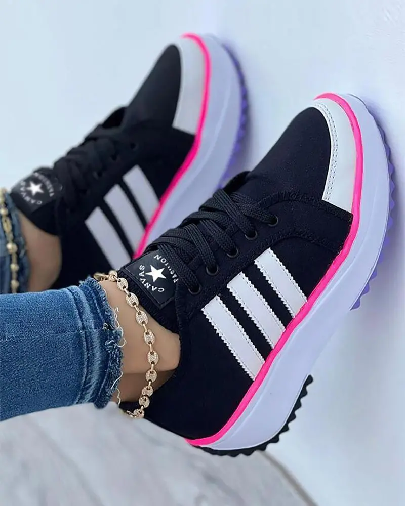 Black comfort trainers with pink trim and white three-bar stripes