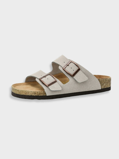 Women's footbed sandals in taupe with two square buckles and cork-textured sole.