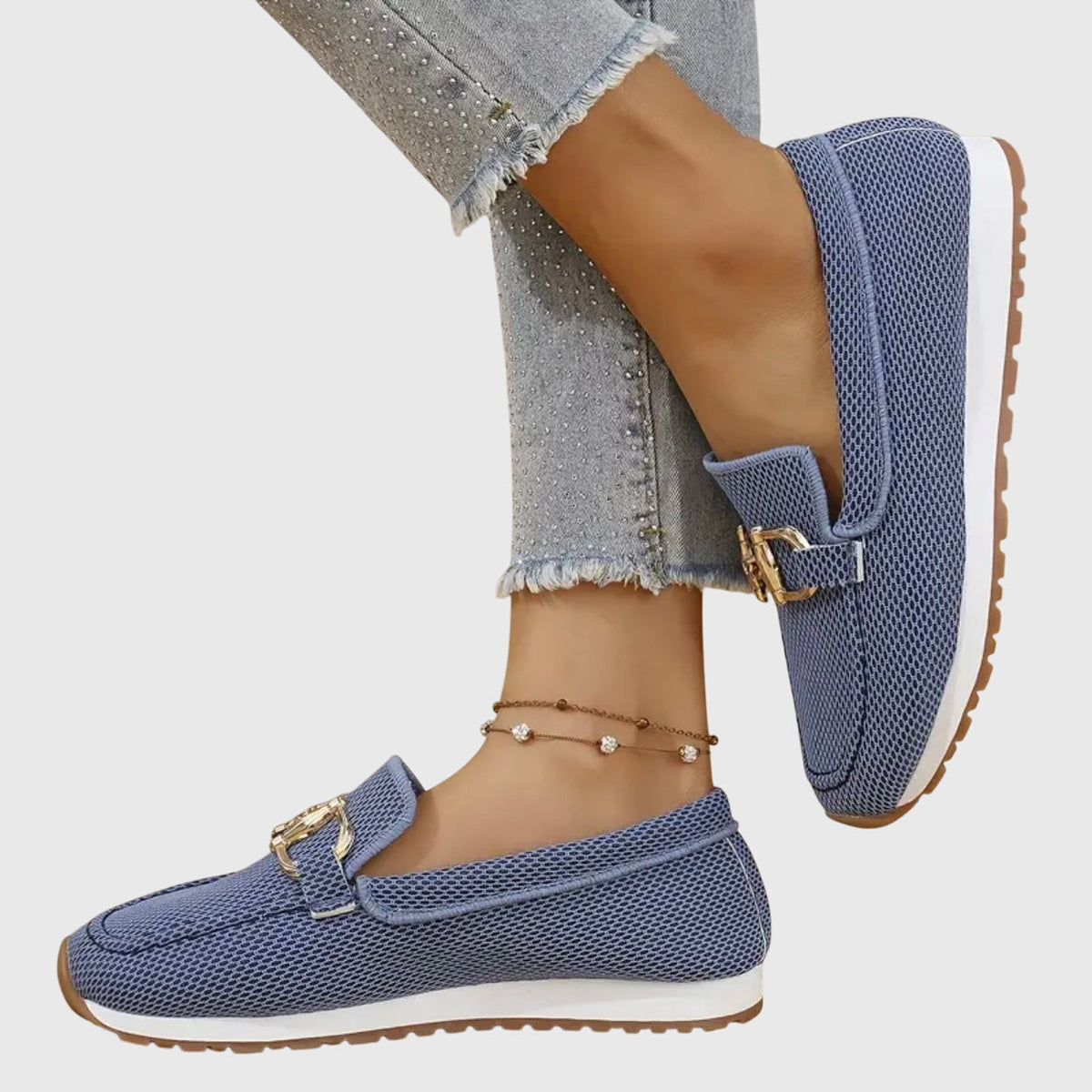 Navy textured ladies loafers with gold buckle ornament and slip-on upper