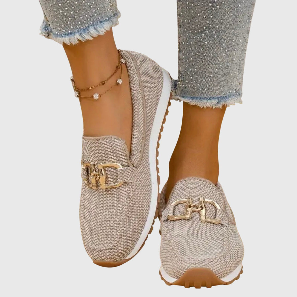 Beige textured ladies loafers with gold buckle and slip-on design