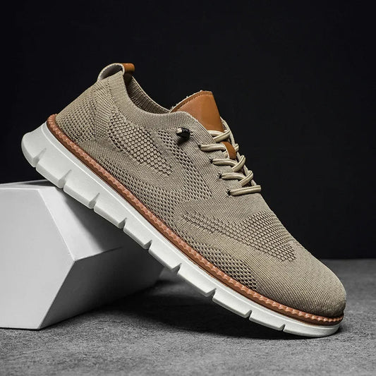 Beige breathable knit sneakers with lace-up front and brown edge trim