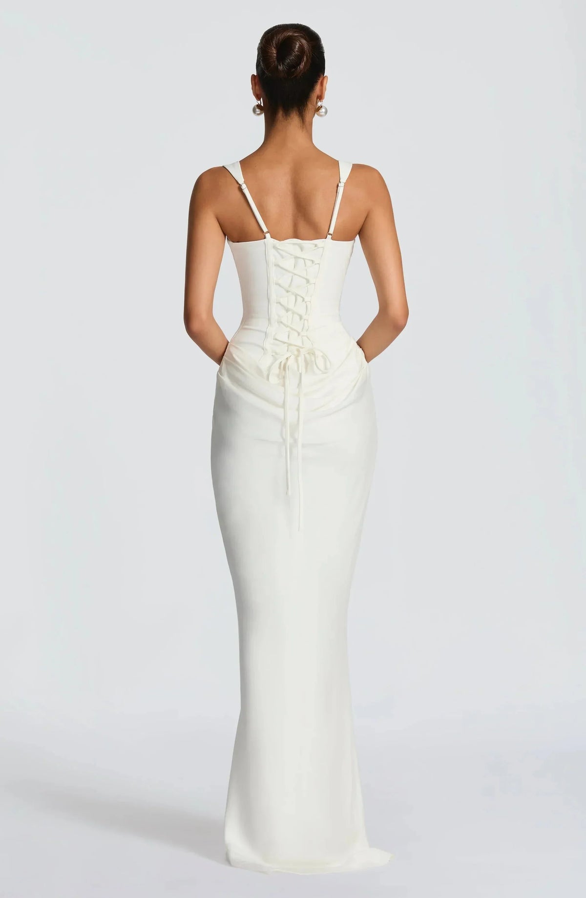 White backless maxi dress with lace-up back panel and ruched waist